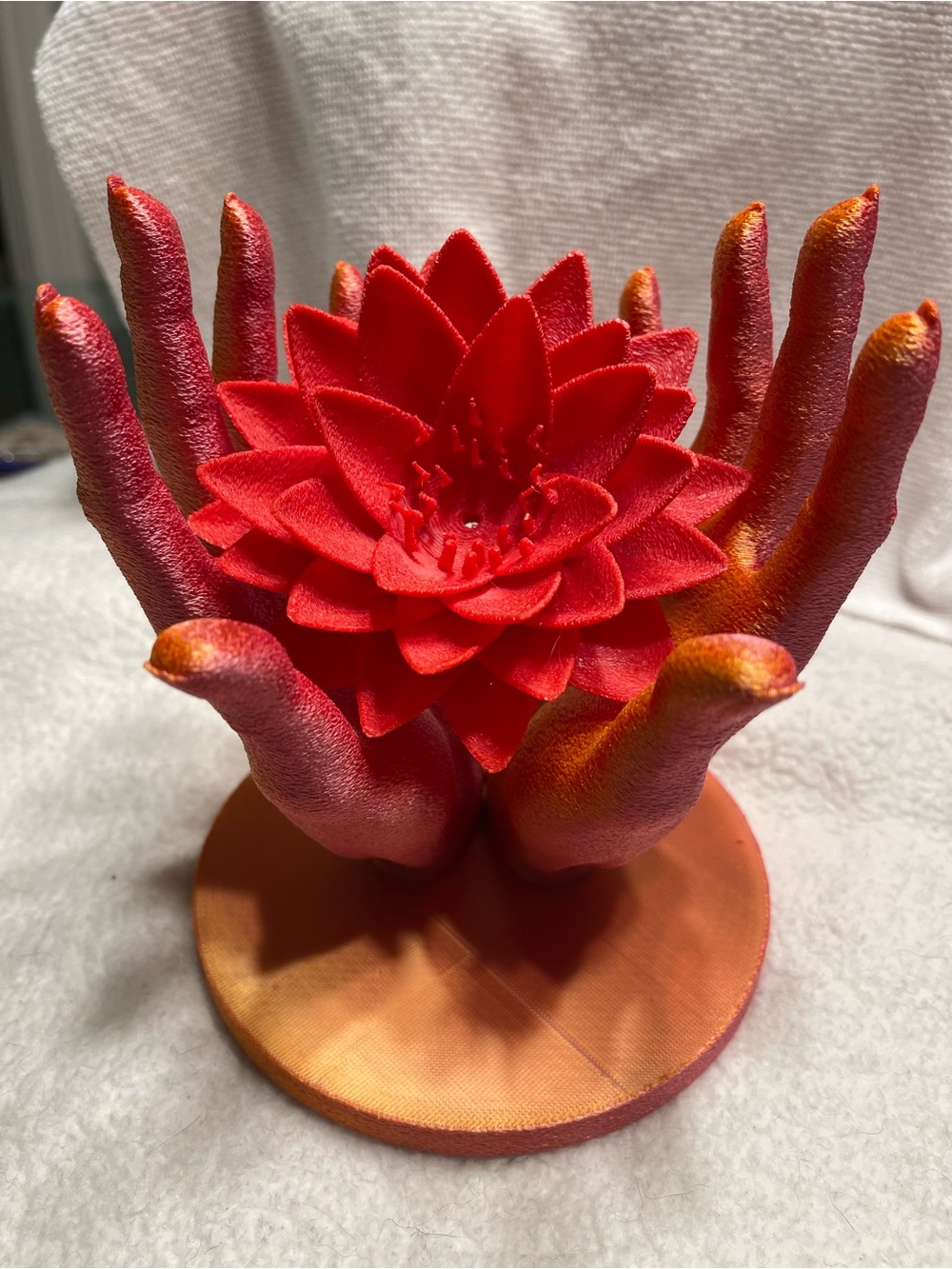 Red Lotus in Hand Sculpture - Vibrant Red Decorative Accent. 3-D art.
